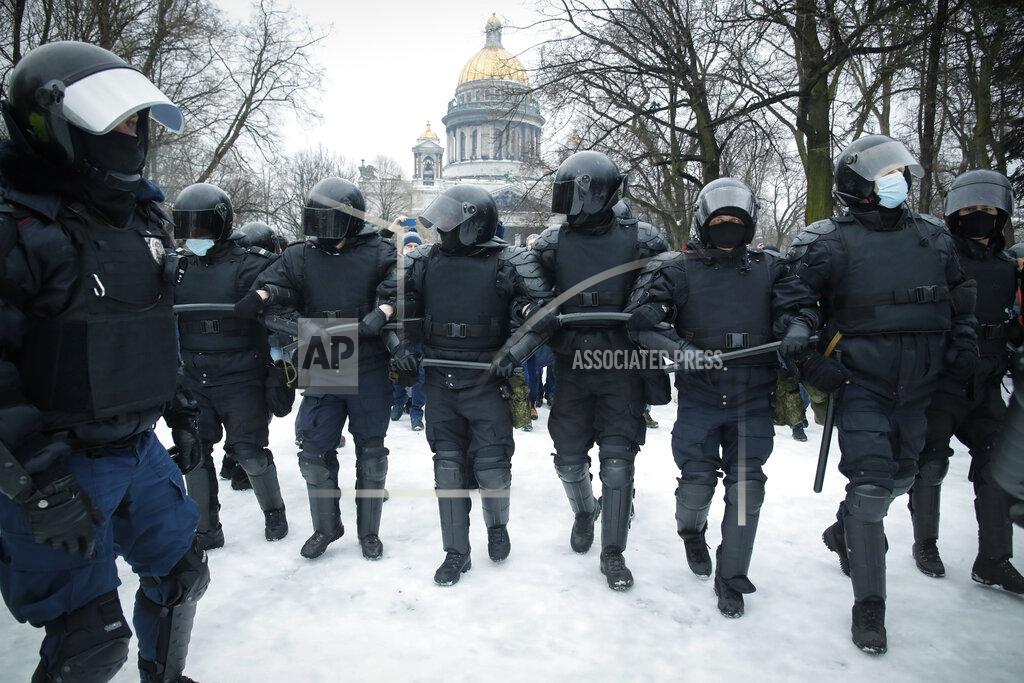 Dmitri Lovetsky Police block demonstrators gathered to protest against the jailing of opposition leader Alexei Navalny in St. Petersburg, Russia, Saturday, Jan. 23, 2021. Russian police on Saturday arrested hundreds of protesters who took to the streets in temperatures as low as minus-50 C (minus-58 F) to demand the release of Alexei Navalny, the country's top opposition figure. Â Navalny, President Vladimir Putin's most prominent foe, was arrested on Jan. 17 when he returned to Moscow from Germany, where he had spent five months recovering from a severe nerve-agent poisoning that he blames on the Kremlin. (AP Photo/Dmitri Lovetsky)