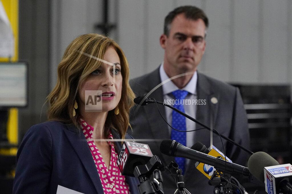 Sue Ogrocki Shelley Zumwalt, Oklahoma Employment Security Commission Executive Director, speaks at a news conference as Oklahoma Gov. Kevin Stitt, right, looks on, Monday, May 17, 2021, in Oklahoma City. Oklahoma will end a $300-a-week federal supplemental unemployment benefit next month. (AP Photo/Sue Ogrocki)