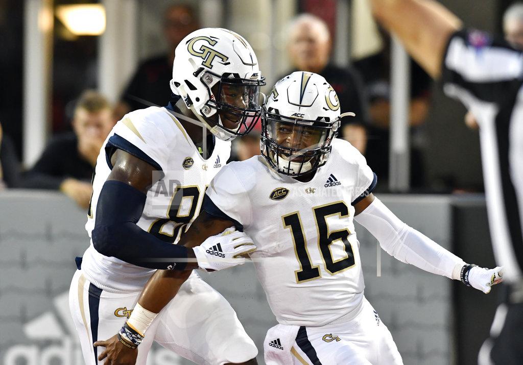 Timothy D. Easley Georgia Tech quarterback TaQuon Marshall (16) celebrates with teammate wide receiver Jalen Camp (80) following his touchdown during the first half of an NCAA college football game against Louisville, Friday, Oct. 5, 2018, in Louisville, Ky. (AP Photo/Timothy D. Easley)