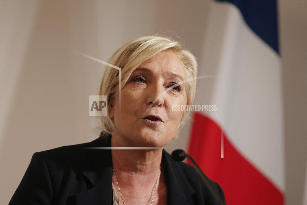 Lewis Joly Far-right leader Marine le Pen speaks during a press conference on immigration Tuesday, Sept. 28, 2021 in Paris. Presidential candidate for the 2022 presidential election Marine Le Pen announced plans for an immigration referendum. (AP Photo/Lewis Joly)