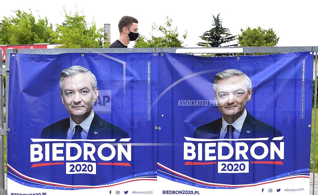 Czarek Sokolowski An electoral poster for left-wing candidate Robert Biedron is seen, in Warsaw, Poland, Tuesday, June 23, 2020. Biedron, who is openly gay, is currently at below 10% in the polls for Sunday's presidential election. (AP Photo/Czarek Sokolowski)