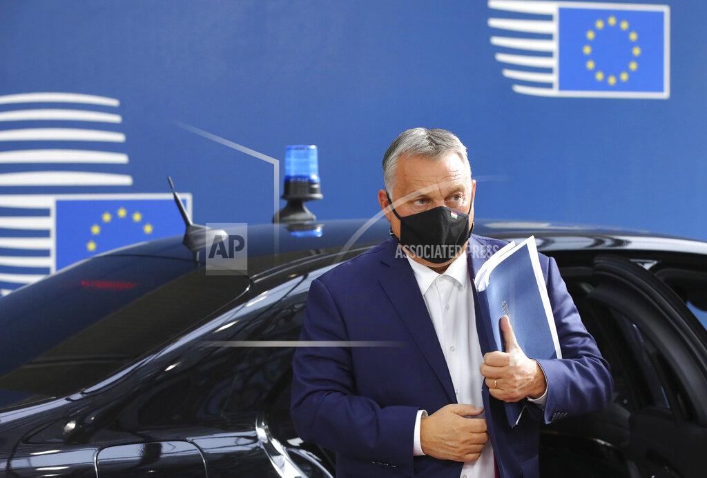 Olivier Matthys FILE - In this Oct. 15, 2020, file photo, Hungary's Prime Minister Viktor Orban arrives for an EU summit at the European Council building in Brussels. The European Union still hasn't completely sorted out its messy post-divorce relationship with Britain — but it has already been plunged into another major crisis. This time the 27-member union is being tested as Poland and Hungary block passage of its budget for the next seven years and an ambitious package aimed at rescuing economies ravaged by the coronavirus pandemic. (AP Photo/Olivier Matthys, Pool, File)