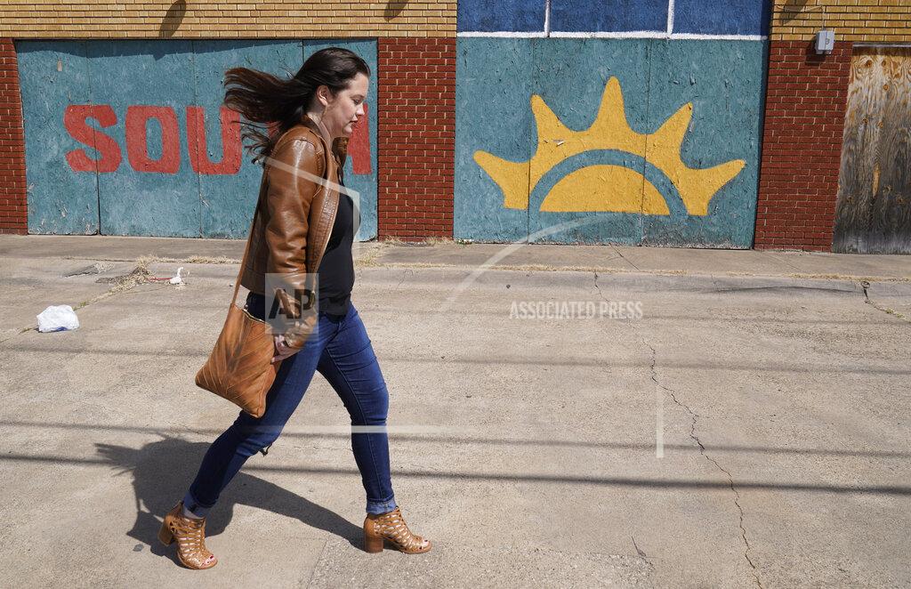 Lm Otero Keri Mitchell, executive editor of the Dallas Free Press, walks on Malcom X Blvd in south Dallas, Monday, March 8, 2021. Mitchell submitted records requests to the Dallas school district that took months to resolve because of the pandemic. The Dallas Independent School District suspended all records requests for seven months while its employees were working from home with laptop computers. "If we can't get timely responses to open-records requests, we can't get people actual answers," Mitchell said. "It just creates another barrier to the information people need to literally survive." (AP Photo/LM Otero)