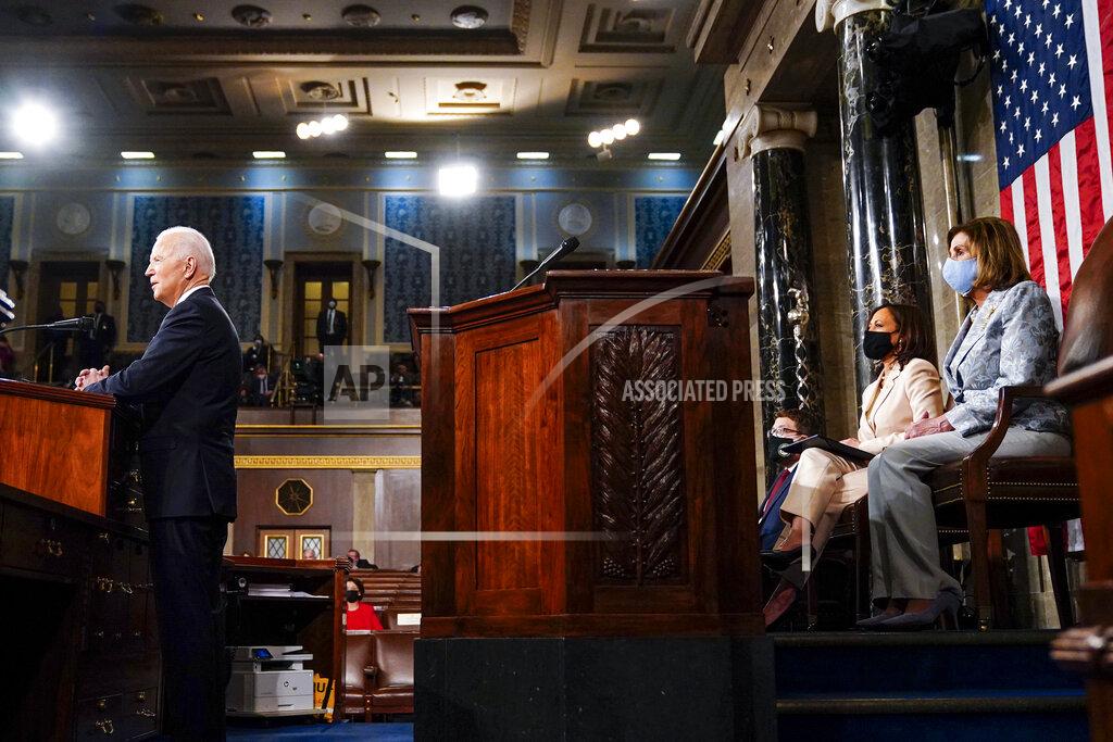Melina Mara President Joe Biden addresses a joint session of Congress, Wednesday, April 28, 2021, in the House Chamber at the U.S. Capitol in Washington, as Vice President Kamala Harris and House Speaker Nancy Pelosi of Calif., look on. (Melina Mara/The Washington Post via AP, Pool)