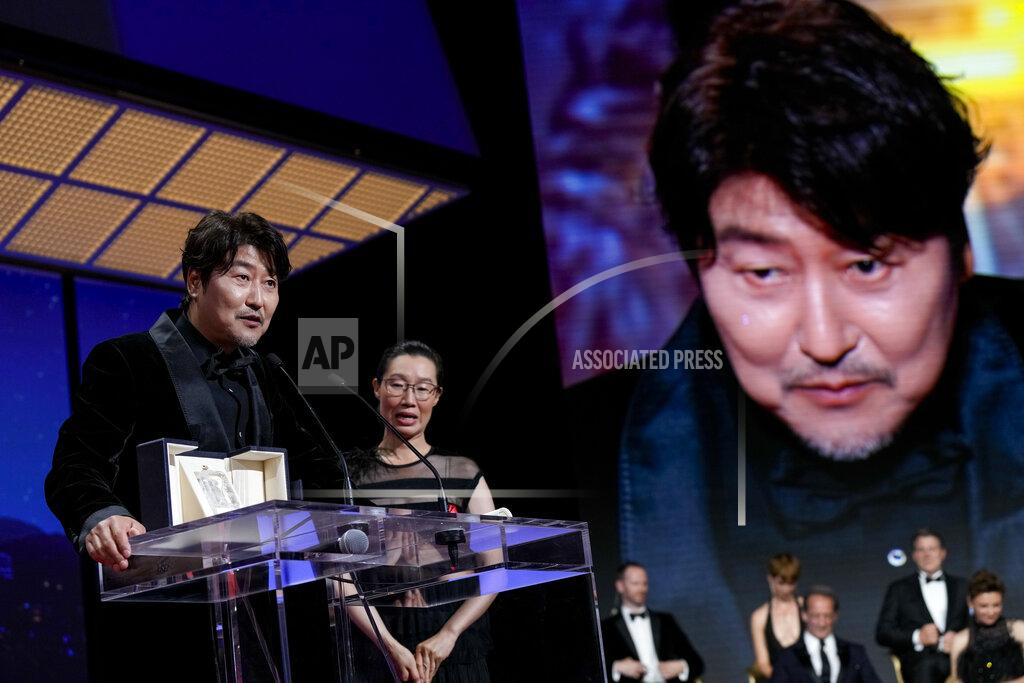 Joel C Ryan Song Kang-ho accepts the award for best actor for 'Broker' during the awards ceremony of the 75th international film festival, Cannes, southern France, Saturday, May 28, 2022. (Photo by Joel C Ryan/Invision/AP)
