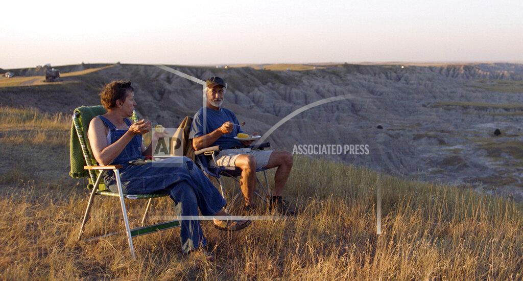 Uncredited This image released by Searchlight Pictures shows Frances McDormand, left, and and David Strathairn in a scene from the film "Nomadland." (Searchlight Pictures via AP)