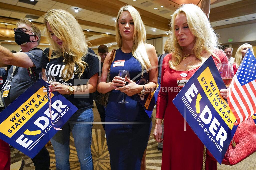 Ashley Landis Supporters of Republican conservative radio show host Larry Elder pray as polls close for the California gubernatorial recall election Tuesday, Sept. 14, 2021, in Costa Mesa, Calif. The rare, late-summer election, which challenged California Gov. Gavin Newsom, has emerged as a national battlefront on issues from COVID-19 restrictions to climate change. (AP Photo/Ashley Landis)