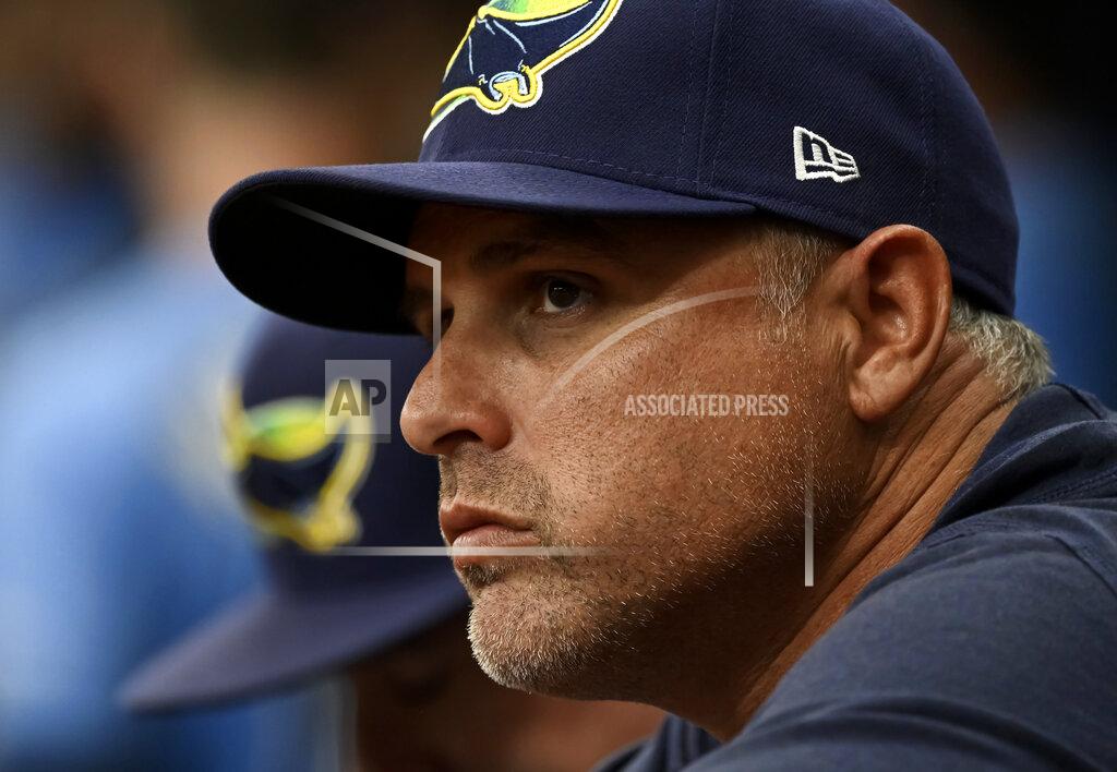 Steve Nesius Tampa Bay Rays manager Kevin Cash watches from the dugout during the fourth inning of a baseball game against the Miami Marlins, Sunday, Sept. 26, 2021, in St. Petersburg, Fla. (AP Photo/Steve Nesius)