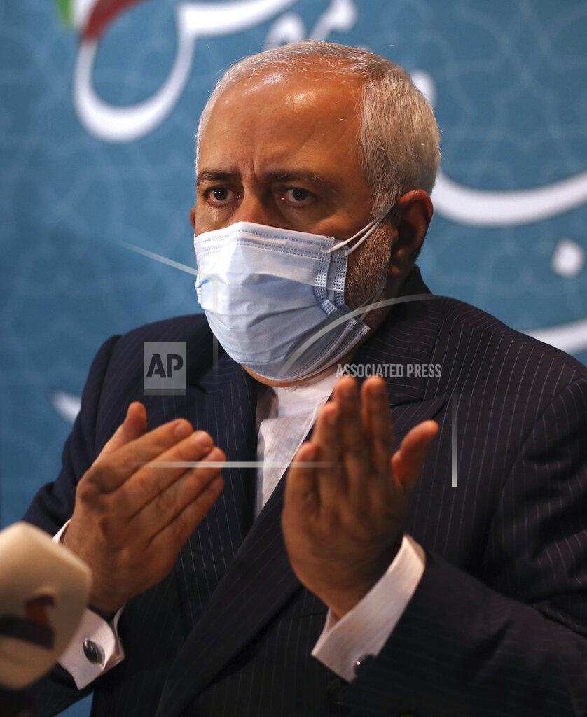 Vahid Salemi Iran's Foreign Minister Mohammad Javad Zarif speaks with journalists following a conference in Tehran, Iran, Tuesday, Feb. 23, 2021. Iran's foreign minister says the country has started implementing a law passed by the parliament to curb UN inspections into its nuclear program. Zarif reiterated that Iran would no longer share surveillance footage of its nuclear facilities with the U.N. agency. (AP Photo/Vahid Salemi)