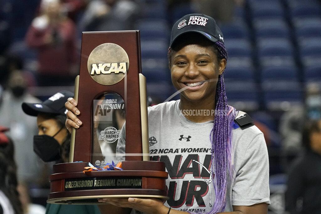 Gerry Broome South Carolina forward Aliyah Boston (4) holds the trophy following a college basketball game against Creighton in the Elite 8 round of the NCAA tournament in Greensboro, N.C., Sunday, March 27, 2022. (AP Photo/Gerry Broome)
