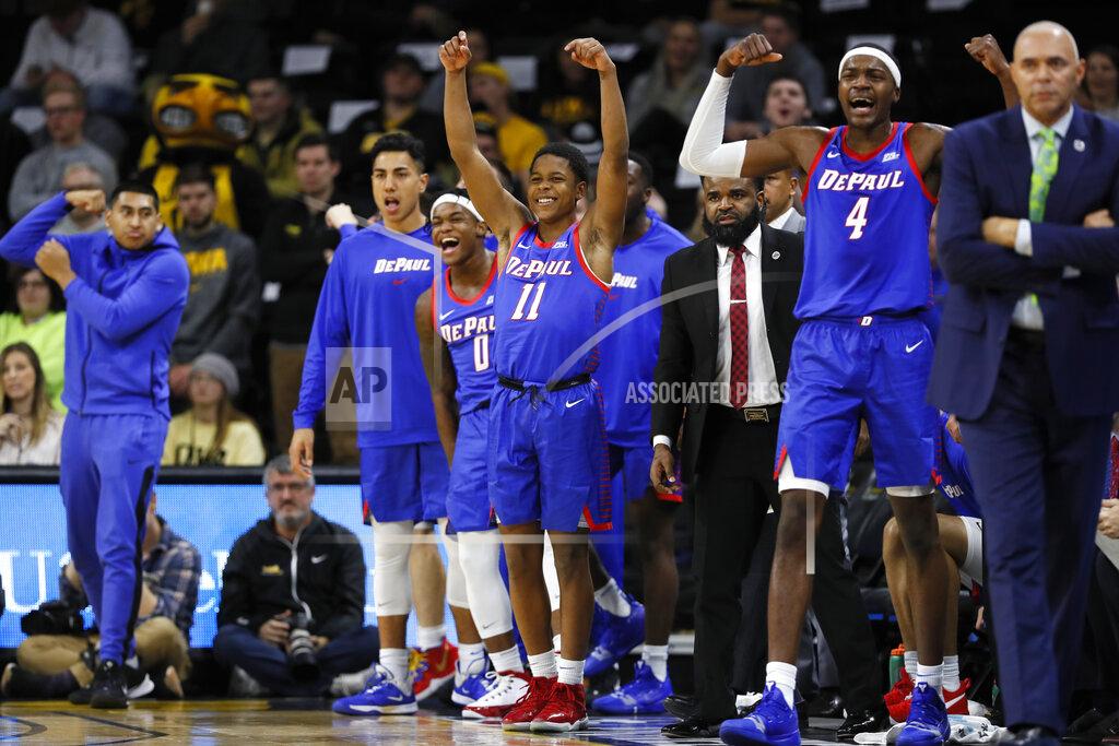 Charlie Neibergall DePaul guard Charlie Moore (11) celebrates on the bench during the first half of an NCAA college basketball game against Iowa, Monday, Nov. 11, 2019, in Iowa City, Iowa.(AP Photo/Charlie Neibergall)
