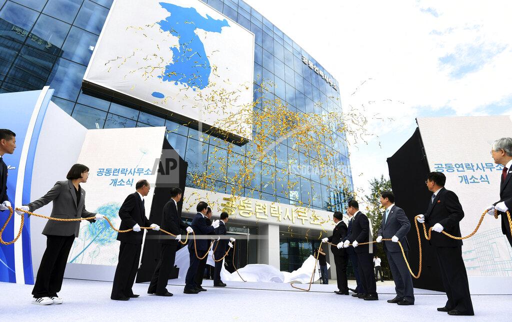 Uncredited FILE - In this Sept. 14, 2018, file photo, South Korea's Unification Minister Cho Myoung-gyon, center left, and Ri Son Gwon, chairman of the North's Committee for the Peaceful Reunification, center right, attend at an opening ceremony for two Koreas' first liaison office in Kaesong, North Korea. South Korea on Tuesday, June 16, 2020, says North Korea blew up an inter-Korean liaison office amid rising tensions between the rivals. (Korea Pool/Yonhap via AP, File)