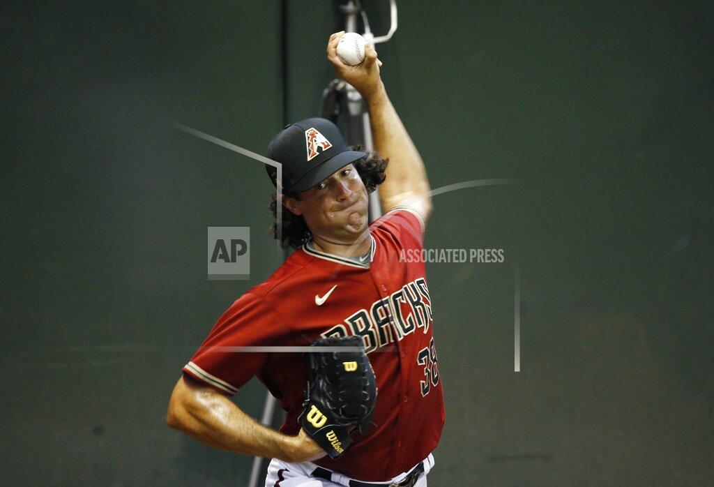 Ross D. Franklin Arizona Diamondbacks starting pitcher Robbie Ray warms up in the bullpen during team baseball practice at Chase Field, Friday, July 3, 2020, in Phoenix. (AP Photo/Ross D. Franklin)