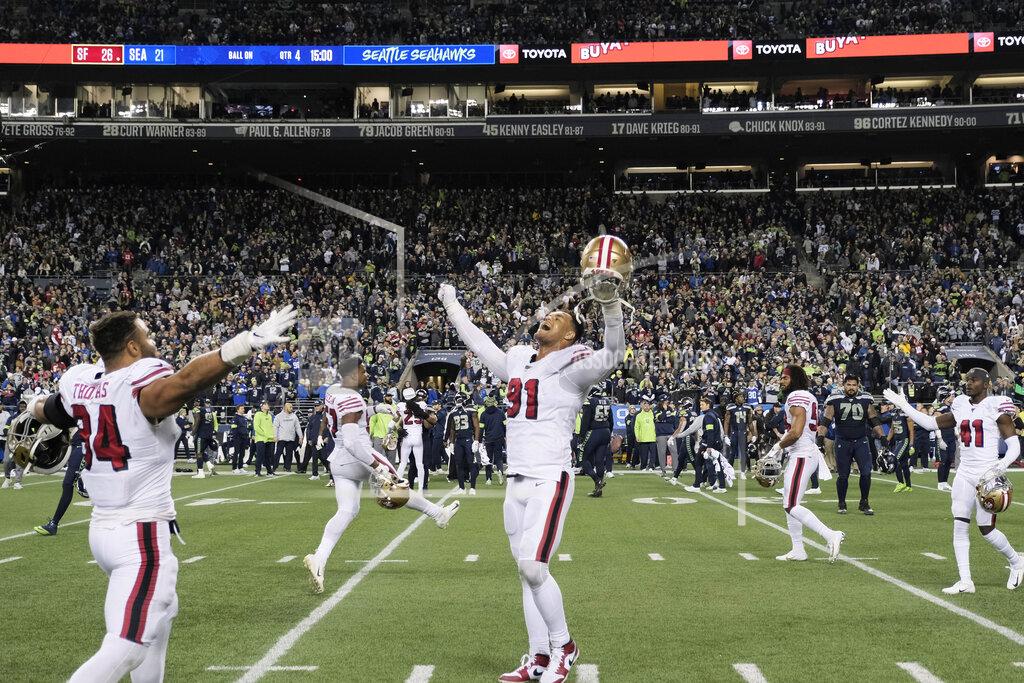 Stephen Brashear San Francisco 49ers' Arik Armstead (91) raises his arms in celebration as time expires in the team's victory over the Seattle Seahawks in an NFL football game, Sunday, Dec. 29, 2019, in Seattle. The 49ers won 26-21. (AP Photo/Stephen Brashear)