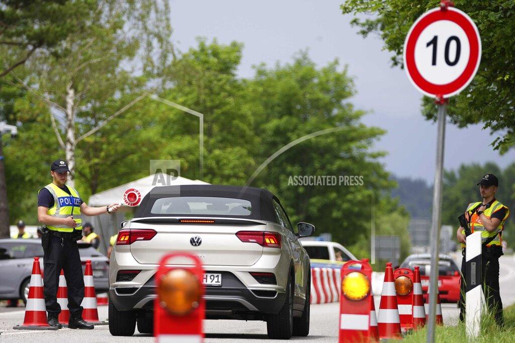 Matthias Schrader FILE - Police officers stop cars at a checkpoint near the Austrian and German border in Mittenwald, Germany, Wednesday, June 22, 2022. The G7 summit takes place in castle 'Elmau' near Garmisch-Partenkirchen from June 26 until June 28, 2022. Three back-to-back summits over the next week will test Western resolve to support Ukraine and the extent of international unity as rising geopolitical tensions and economic pain cast an increasingly long shadow. (AP Photo/Matthias Schrader, File)