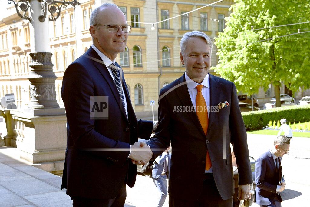 Antti Aimo-Koivisto Irish Foreign Minister Simon Coveney, left, and Finnish Foreign Minister Pekka Haavisto meet at the House of Estates in Helsinki, Finland, Tuesday, June 7, 2022. (Antti Aimo-Koivisto/Lehtikuva via AP)