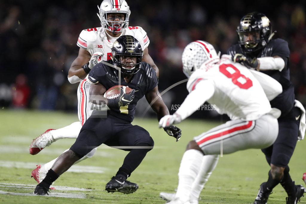 Michael Conroy Purdue running back D.J. Knox (1) cuts in front of Ohio State cornerback Kendall Sheffield (8) during the first half of an NCAA college football game in West Lafayette, Ind., Saturday, Oct. 20, 2018. (AP Photo/Michael Conroy)