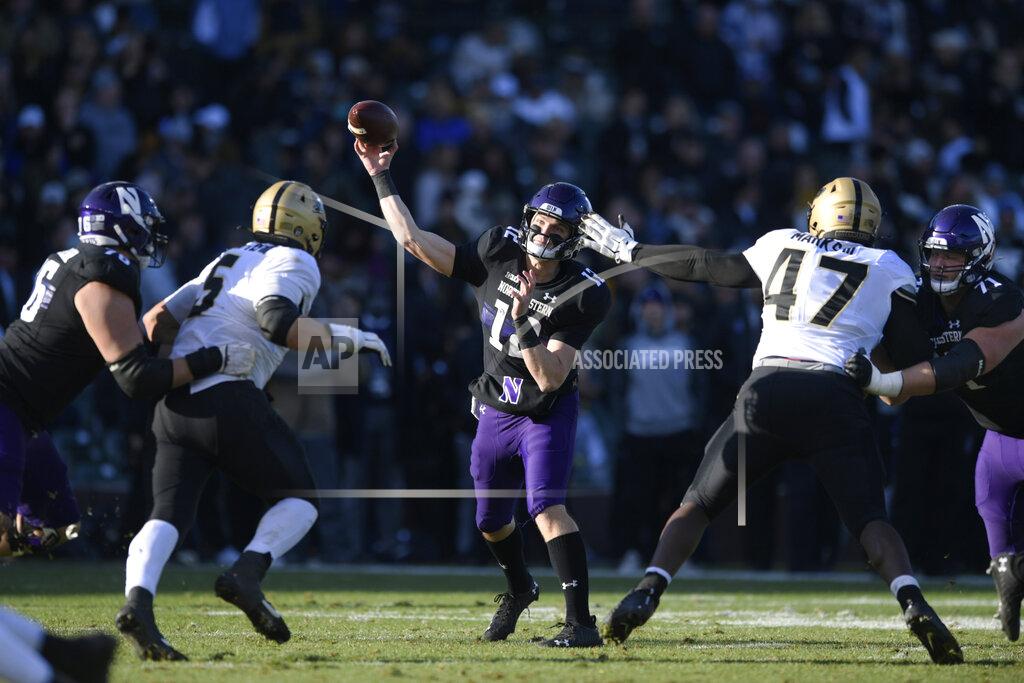 Paul Beaty Northwestern quarterback Ryan Hilinski (12) throws during the second half of an NCAA college ootball game against Purdue, Saturday, Nov. 20, 2021 at Wrigley Field in Chicago. Purdue won 32-14. (AP Photo/Paul Beaty)