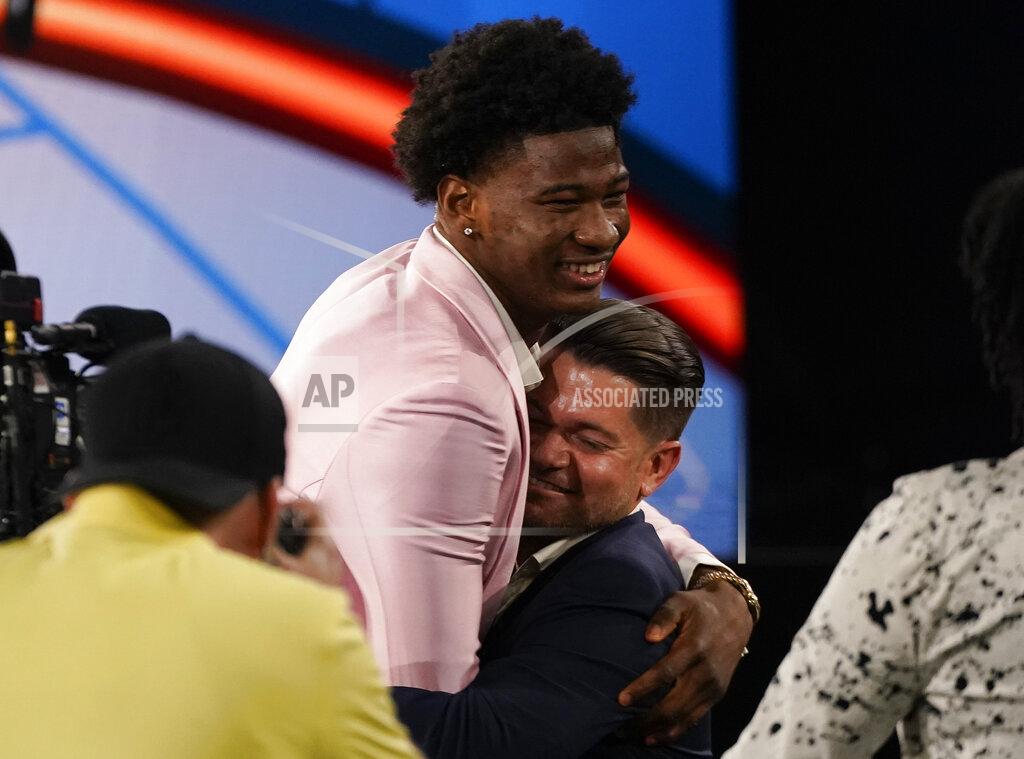 Corey Sipkin Kai Jones reacts after being selected as the 19th overall selection by the New York Knicks during the NBA basketball draft, Thursday, July 29, 2021, in New York. (AP Photo/Corey Sipkin)