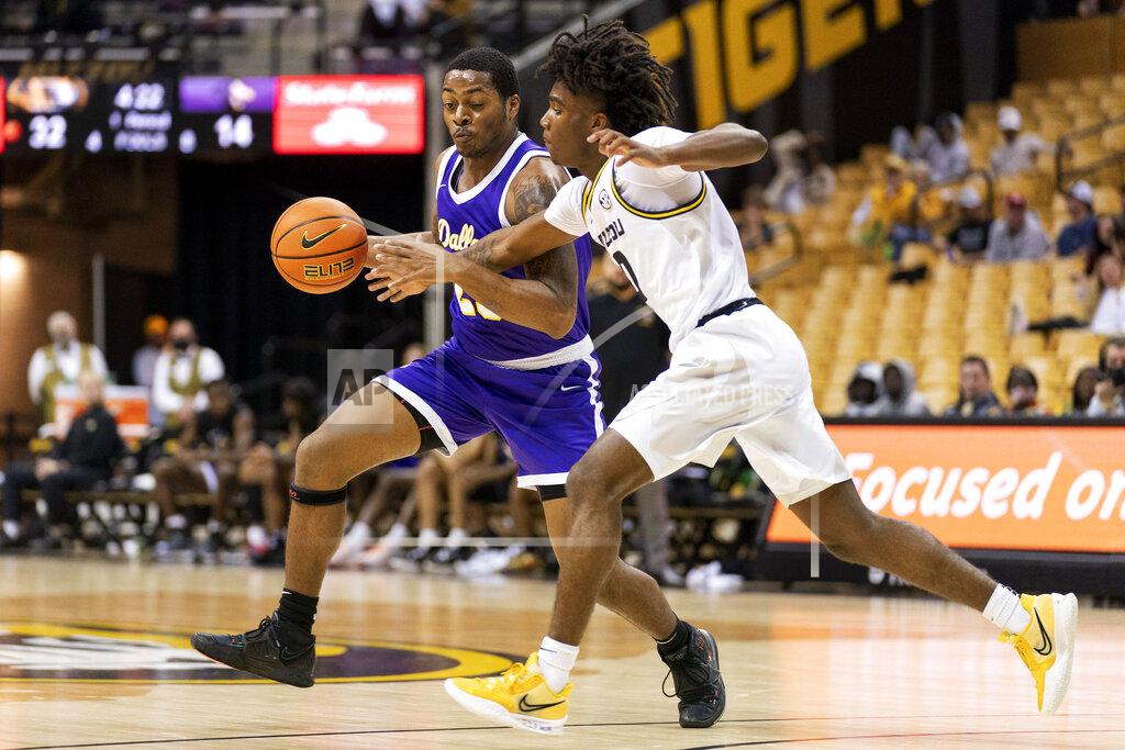 L.g. Patterson Paul Quinn's Bruce Scott, left, drives past Missouri's Anton Brookshire, right, during the first half of an NCAA college basketball game Monday, Nov. 29, 2021, in Columbia, Mo. (AP Photo/L.G. Patterson)