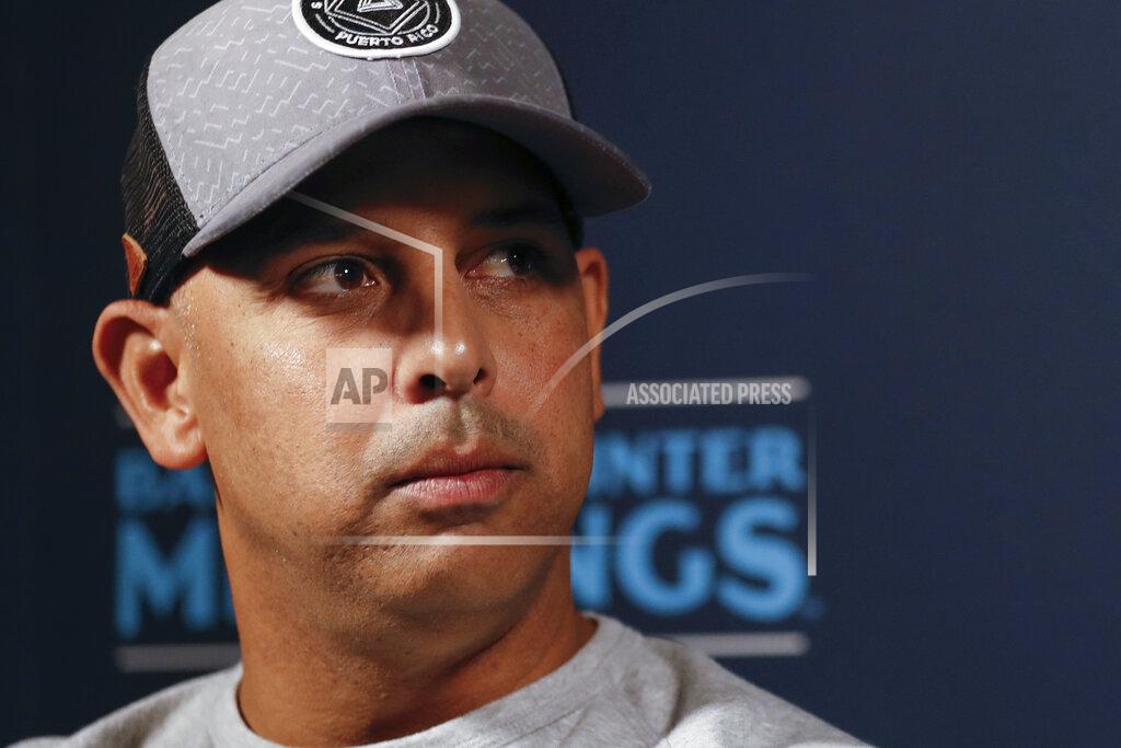 Gregory Bull FILE - In this Dec. 9, 2019, file photo, Boston Red Sox manager Alex Cora listens to a question during the Major League Baseball winter meetings, in San Diego. Houston manager AJ Hinch and general manager Jeff Luhnow were suspended for the entire season Monday, Jan. 13, 2020, and the team was fined $5 million for sign-stealing by the team in 2017 and 2018 season. Commissioner Rob Manfred announced the discipline and strongly hinted that current Boston manager Alex Cora — the Astros bench coach in 2017 — will face punishment later. Manfred said Cora developed the sign-stealing system used by the Astros. (AP Photo/Gregory Bull, File)