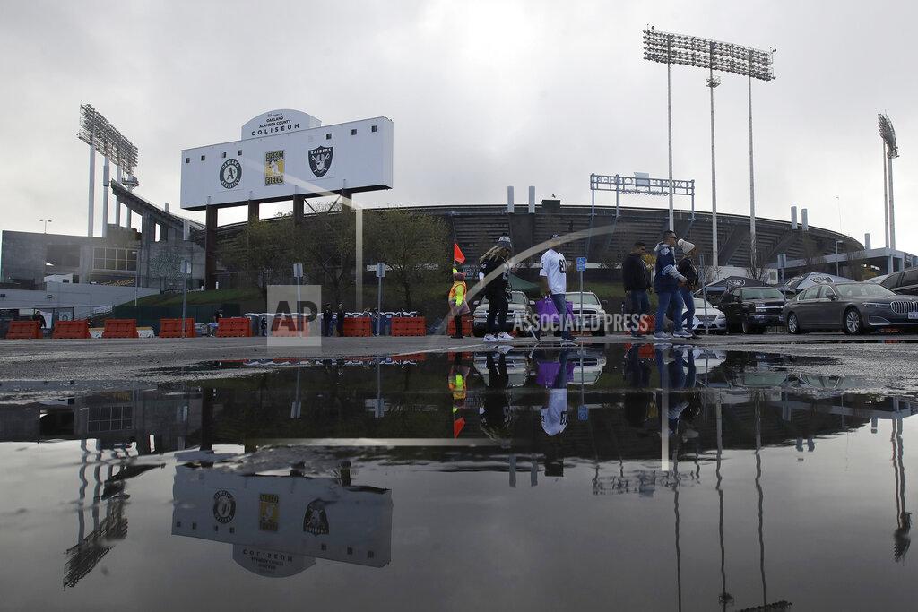 Jeff Chiu In this Dec. 8, 2019, photo, fans tailgate at RingCentral Coliseum before an NFL football game between the Oakland Raiders and the Tennessee Titans in Oakland, Calif. The Raiders' final scheduled game in Oakland on Sunday, Dec. 15, 2019, will be an emotional one for players and coaches, as well as fans. (AP Photo/Jeff Chiu)