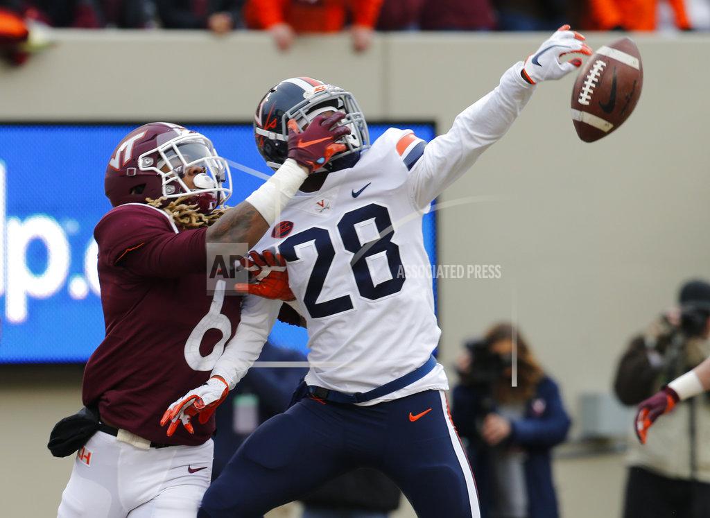 Steve Helber Virginia safety Brenton Nelson (28) breaks up pass intended for Virginia Tech wide receiver Hezekiah Grimsley (6) during the first half of an NCAA college football game in Blacksburg, Va., Friday, Nov. 23, 2018. (AP Photo/Steve Helber)