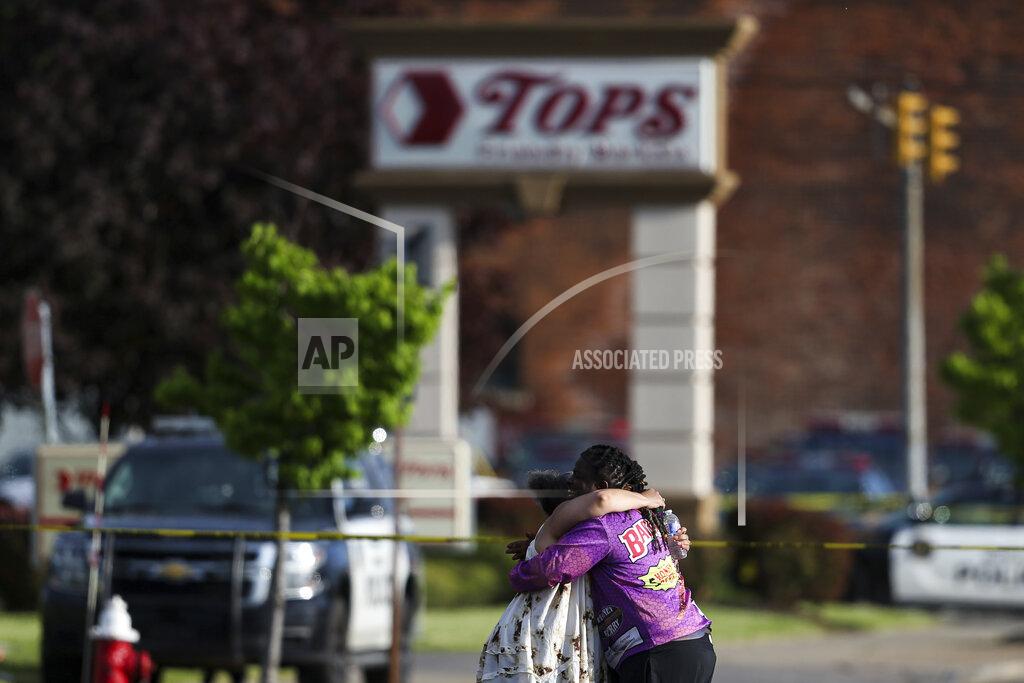 Joshua Bessex FILE - People hug outside the scene after a shooting at a supermarket on May 14, 2022, in Buffalo, N.Y. The NAACP, the nation's oldest civil rights organization said it will propose a sweeping plan meant to protect Black Americans from white supremacist violence, in response to a hate-fueled massacre that killed 10 Black people in Buffalo, New York last weekend. (AP Photo/Joshua Bessex, File)