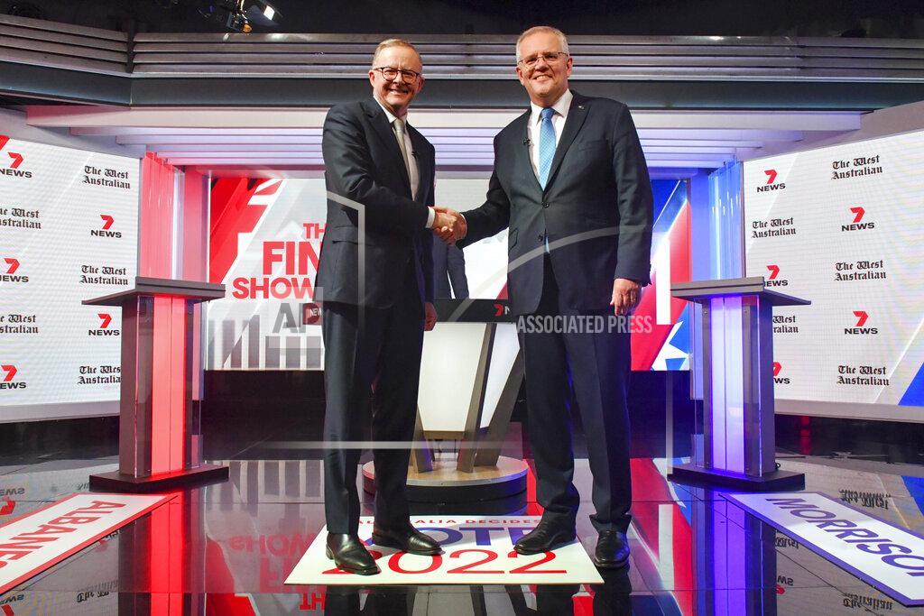 Mick Tsikas FILE - Australian Prime Minister Scott Morrison, right, and Australian opposition leader Anthony Albanese shake hands ahead of the leaders' debate in Sydney, Australia, on May 11, 2022. Australians go to the polls on Saturday, May 21, following a six-week election campaign that has focused on pandemic-fueled inflation, climate change and fears of a Chinese military outpost being established less than 2,000 kilometers (1,200 miles) off Australia’s shore.(Mick Tsikas/Pool Photo via AP, File)