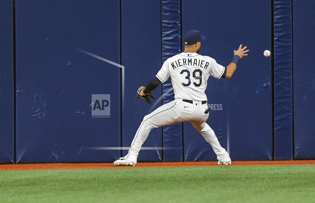 Steve Nesius Tampa Bay Rays center fielder Kevin Kiermaier reaches for a line-drive single off the wall hit by New York Yankees' Gleyber Torres during the fourth inning of a baseball game Tuesday, July 27, 2021, in St. Petersburg, Fla. (AP Photo/Steve Nesius)