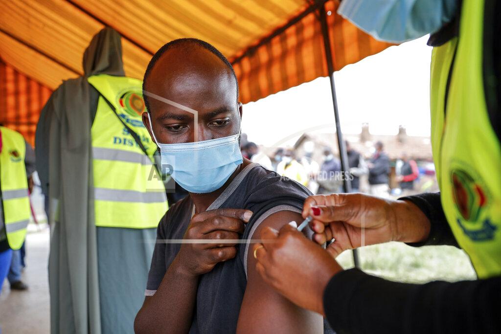 Brian Inganga A Kenyan man receives a dose of AstraZeneca coronavirus vaccine donated by Britain, at the Makongeni Estate in Nairobi, Kenya Saturday, Aug. 14, 2021. In late June, the international system for sharing coronavirus vaccines sent about 530,000 doses to Britain – more than double the amount sent that month to the entire continent of Africa. It was the latest example of how a system that was supposed to guarantee low and middle-income countries vaccines is failing, leaving them at the mercy of haphazard donations from rich countries. (AP Photo/Brian Inganga)
