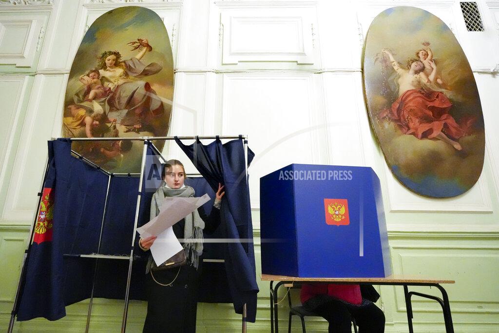 Dmitri Lovetsky A woman prepares to cast her ballot during the State Duma, the Lower House of the Russian Parliament and local parliaments elections at a polling station situated in an old palace in St. Petersburg, Russia, Saturday, Sept. 18, 2021. Sunday will be the last of three days voting for a new parliament, but there seems to be no expectation that United Russia, the party devoted to President Vladimir Putin, will lose its dominance in the State Duma. (AP Photo/Dmitri Lovetsky)