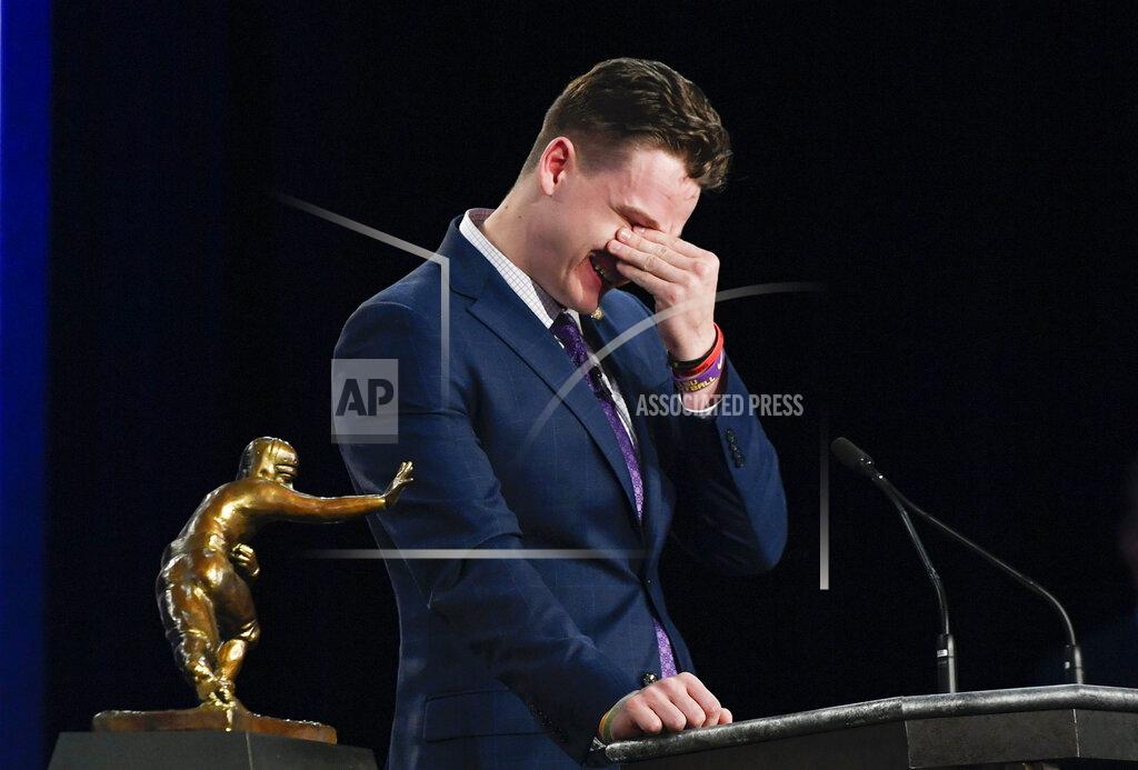Todd Van Emst NCAA college football player, LSU quarterback Joe Burrow reacts while speaking after being awarded the Heisman Trophy, Saturday, Dec. 14, 2019, in New York. (Todd Van Emst/Pool Photo via AP)