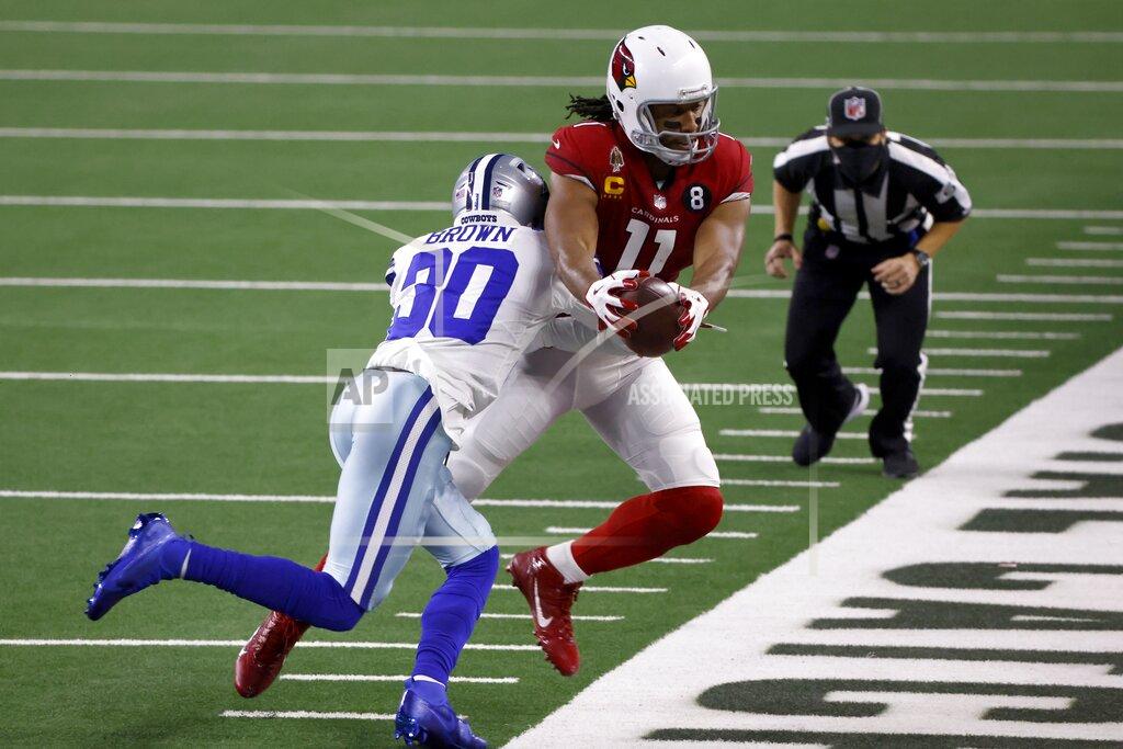 Ron Jenkins Dallas Cowboys cornerback Anthony Brown (30) stops Arizona Cardinals wide receiver Larry Fitzgerald (11) after Fitzgerald caught a pass for a first down in the first half of an NFL football game in Arlington, Texas, Monday, Oct. 19, 2020. (AP Photo/Ron Jenkins)