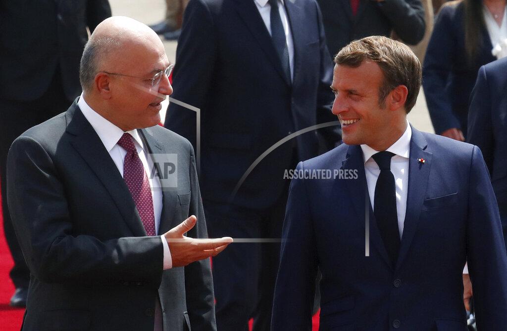 Gonzalo Fuentes Iraqi President Barham Salih welcomes French President Emmanuel Macron, right, as he arrives at the Salam Palace Wednesday, Sept. 2, 2020 in Baghdad. Macron is the first head of state to visit the Iraqi capital since Prime Minister Mustafa al-Kadhimi, Iraq's former intelligence chief, formed a new government in May. (Gonzalo Fuentes/Pool via AP)