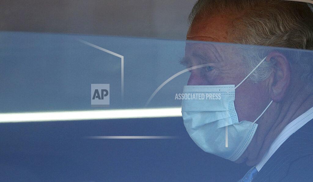 Yui Mok Britain's Price Charles leaves after visiting a NHS vaccine pop-up clinic at Jesus House church, in London, Tuesday March 9, 2021. (Yui Mok/PA via AP)