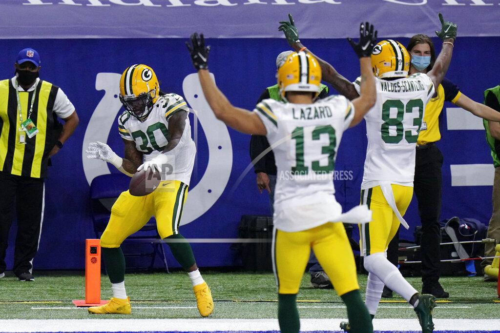Aj Mast Green Bay Packers' Jamaal Williams (30) celebrates a touchdown during the first half of an NFL football game against the Indianapolis Colts, Sunday, Nov. 22, 2020, in Indianapolis. (AP Photo/AJ Mast)