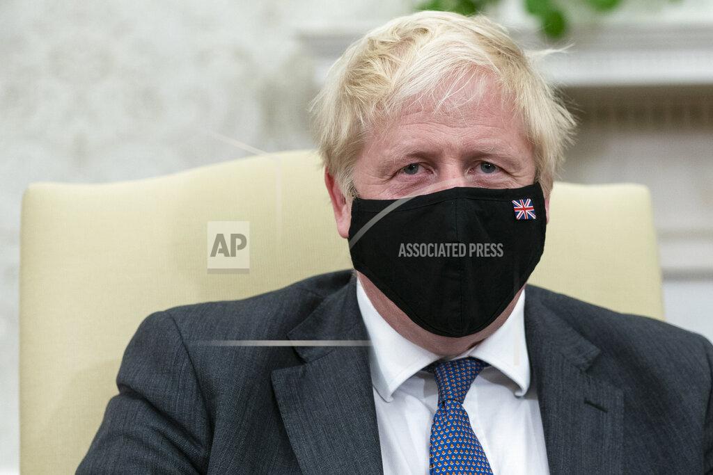 Alex Brandon British Prime Minister Boris Johnson listens during a meeting with President Joe Biden in the Oval Office of the White House, Tuesday, Sept. 21, 2021, in Washington. (AP Photo/Alex Brandon)