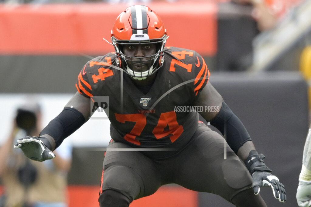 David Richard FILE - In this Sept. 8, 2019, file photo, Cleveland Browns offensive tackle Chris Hubbard (74) blocks in the second half of an NFL football game against the Tennessee Titans in Cleveland. Hubbard agreed to rework his contract after the team signed free agent Jack Conklin, a person familiar with the deal told The Associated Press on Thursday, March 26, 2020. (AP Photo/David Richard, File)