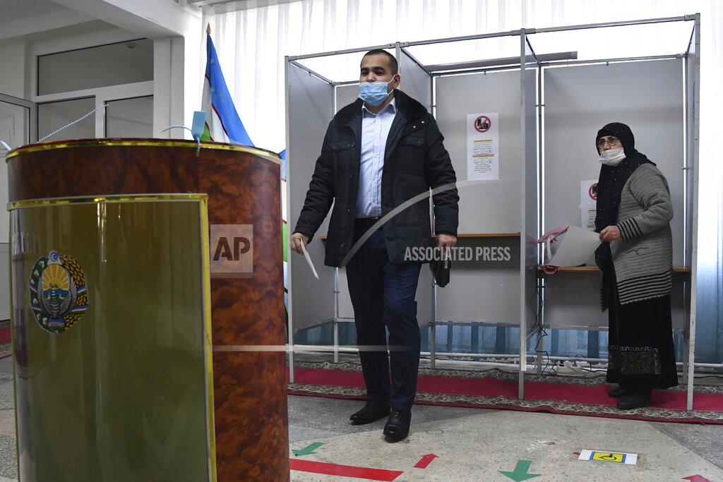 Uncredited A man walks to cast his ballot at a polling station during the presidential election in Tashkent, Uzbekistan, Sunday, Oct. 24, 2021. Uzbekistan's President, Shavkat Mirziyoyev, who has relaxed many of the policies of his dictatorial predecessor but has made little effort at political reform, is expected to win a new term by a landslide against weak competition in an election Sunday. (AP Photo)