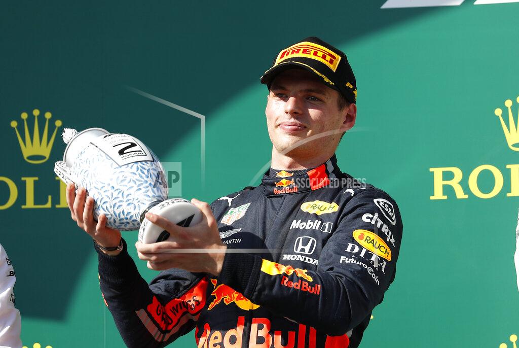 Laszlo Balogh Red Bull driver Max Verstappen, of the Netherlands, celebrates on the podium after taking a second place during the Hungaroring racetrack in Mogyorod, northeast of Budapest, Hungary, Sunday, Aug. 4, 2019. (AP Photo/Laszlo Balogh)