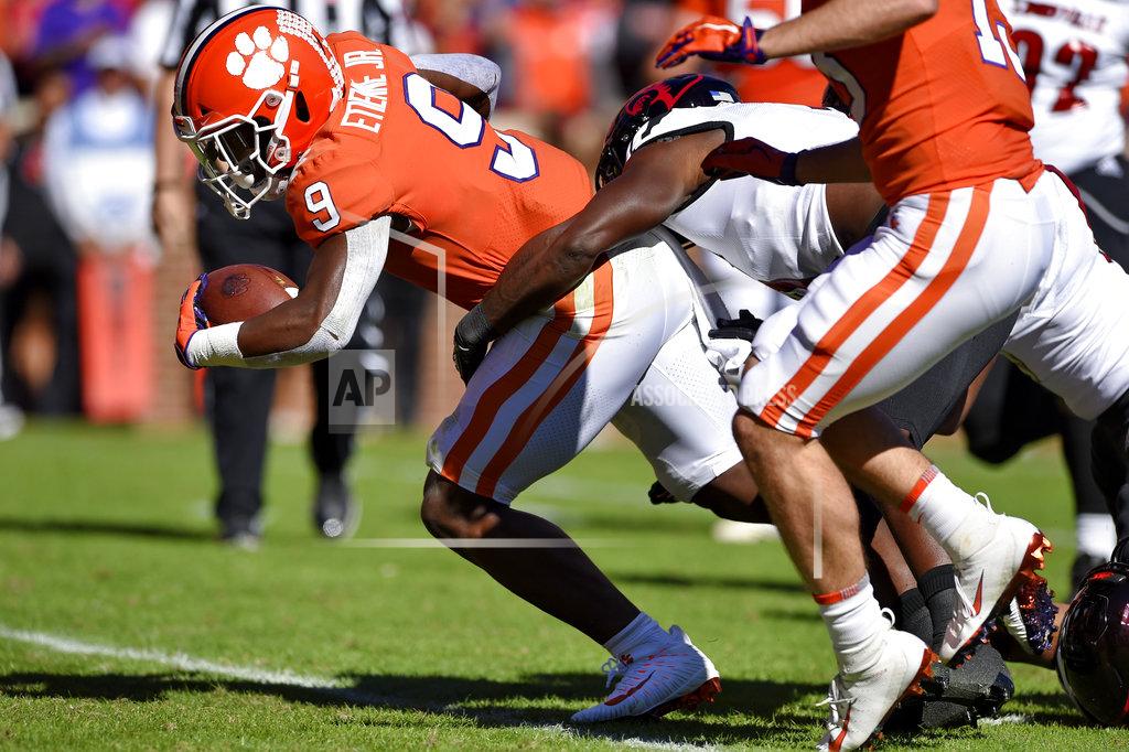 Richard Shiro Clemson's Travis Etienne rushes in for a touchdown during the first half of an NCAA college football game against Louisville, Saturday, Nov. 3, 2018, in Clemson, S.C. (AP Photo/Richard Shiro)