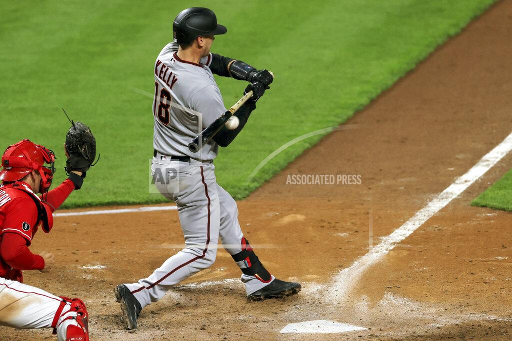 Aaron Doster Arizona Diamondbacks' Carson Kelly reacts as he is hit by a pitch for an RBI during the tenth inning of a baseball game against the Cincinnati Reds, Wednesday, April 21, 2021. The Diamondbacks won 8-5. (AP Photo/Aaron Doster)