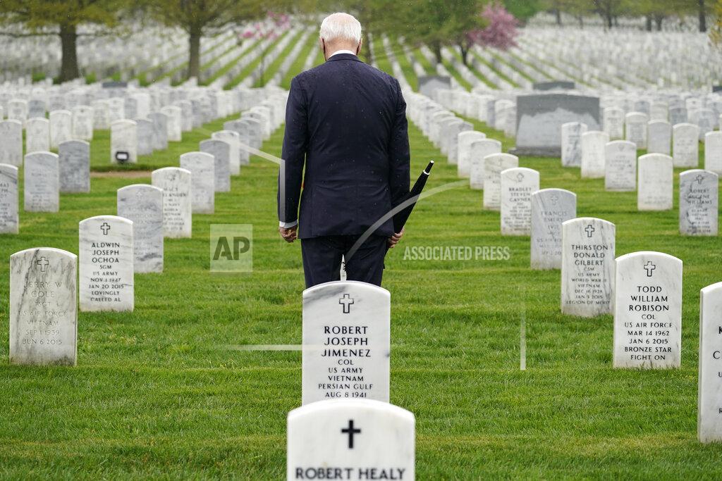 Andrew Harnik President Joe Biden visits Section 60 of Arlington National Cemetery in Arlington, Va., on Wednesday, April 14, 2021. Biden announced the withdrawal of the remainder of U.S. troops from Afghanistan by Sept. 11, 2021, the 20th anniversary of the terrorist attacks on America. (AP Photo/Andrew Harnik)