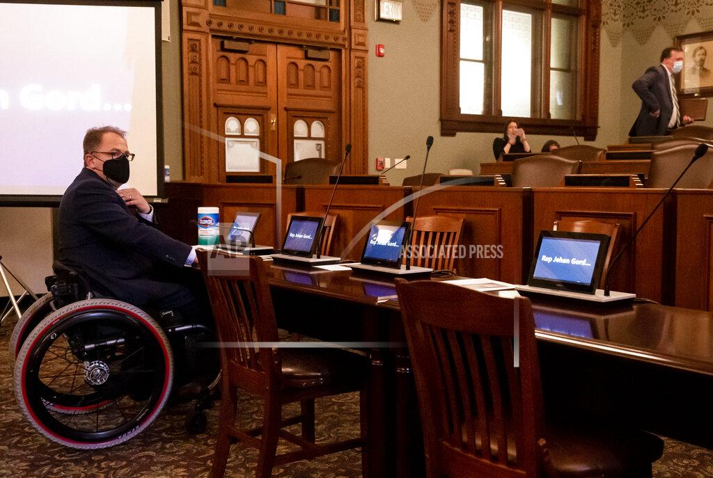 Justin L. Fowler Illinois Senate Minority Leader Dan McConchie, R-Hawthorn Woods, sits at the witness table as he was unable to enter the lawmakers section of the hearing room that is not handicap accessible for a public hearing with the House and Senate redistricting committees on the proposed boundaries for new state legislative districts at the Illinois State Capitol in Springfield, Ill., Tuesday, May 25, 2021. (Justin L. Fowler/The State Journal-Register via AP)