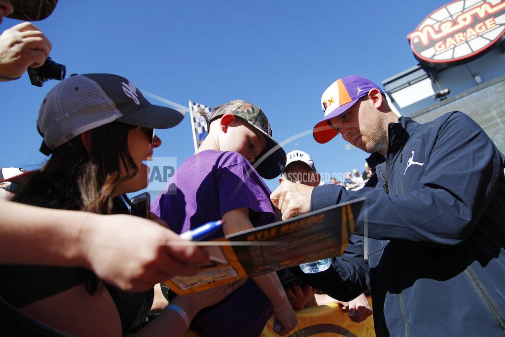 John Locher Denny Hamlin gives autographs to fans before a NASCAR Cup Series auto race at Las Vegas Motor Speedway, Sunday, March 3, 2019, in Las Vegas. (AP Photo/John Locher)