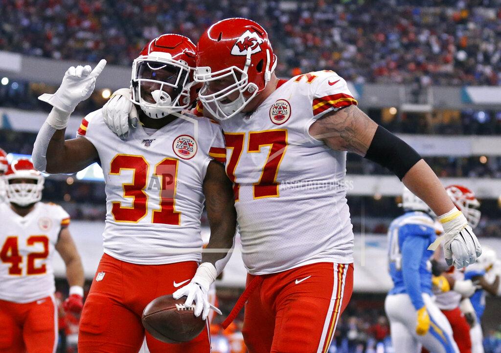 Rebecca Blackwell Kansas City Chiefs running back Darrel Williams (31) celebrates with teammate offensive guard Andrew Wylie after scoring a touchdown during the second half of an NFL football game against the Los Angeles Chargers, Monday, Nov. 18, 2019, in Mexico City. (AP Photo/Rebecca Blackwell)