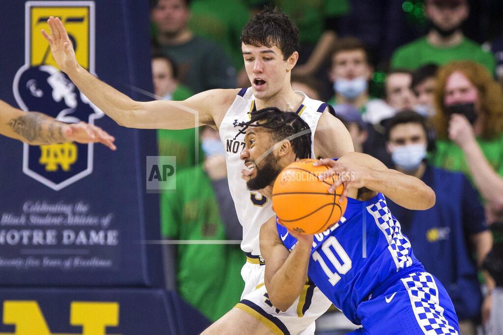 Robert Franklin Kentucky's Davion Mintz (10) drives against Notre Dame's Cormac Ryan (5) during an NCAA college basketball game Saturday, Dec. 11, 2021, in South Bend, Ind. (AP Photo/Robert Franklin)