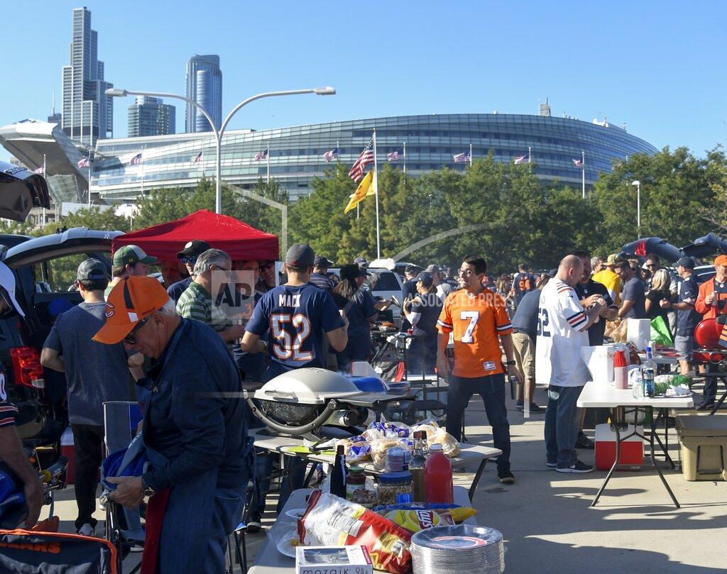 David Banks Fans tailgate outside Soldier Field before an NFL football game between the Green Bay Packers and the Chicago Bears Thursday, Sept. 5, 2019, in Chicago. (AP Photo/David Banks)