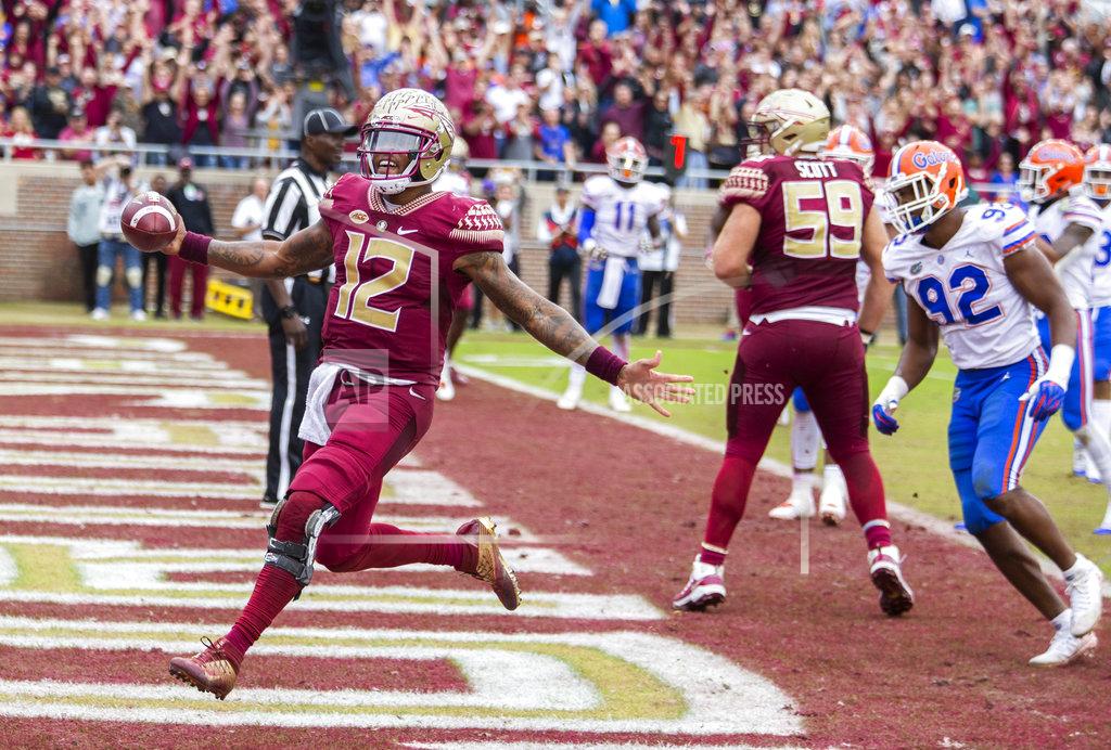 Mark Wallheiser Florida State quarterback Deondre Francois (12) scores on a four yard run in the second half of an NCAA college football game against Florida in Tallahassee, Fla., Saturday, Nov. 24, 2018. Florida defeated Florida State 41-14. (AP Photo/Mark Wallheiser)
